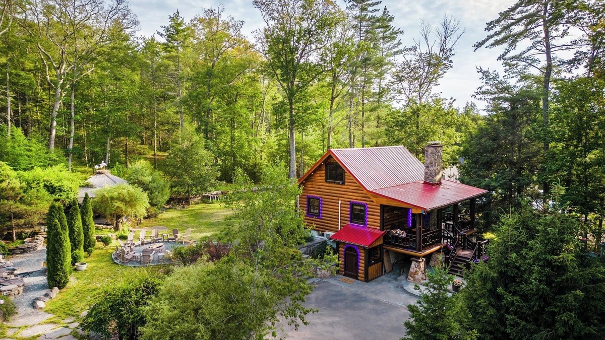 Yulan House | Private log cabin nestled at the base of a secluded wooded area n