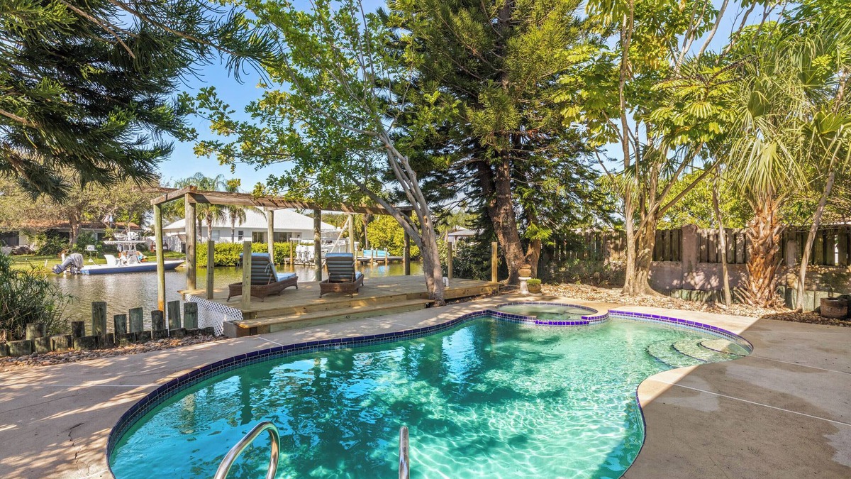 River Isles House | Private wooded 3BR/3BA house w/heated pool on canal just steps from beach