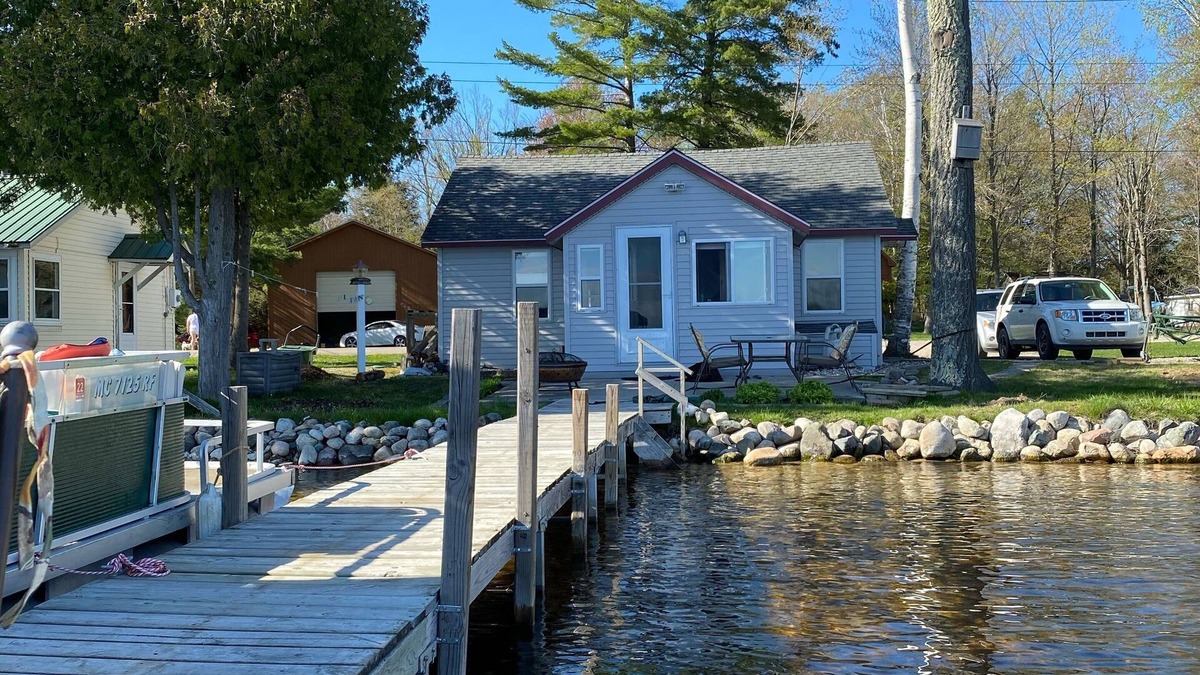 Carp Lake Cottage | Quaint Cottage with a Private Dock on Paradise Lake
