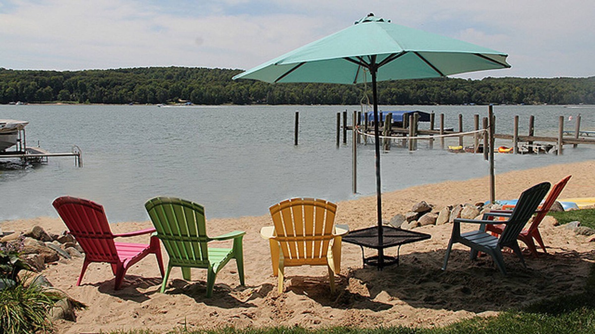 East Jordan Cottage | Rare Sandy Beach Lake Charlevoix Front Home -- Spacious Beach, Fishing, Shade