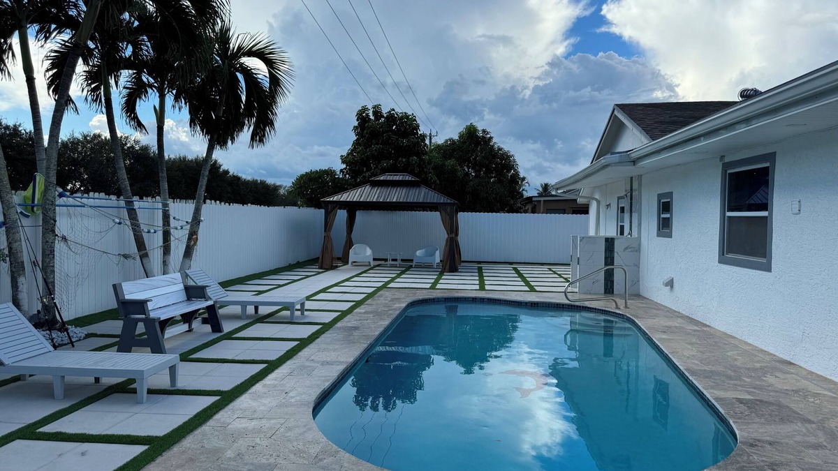 Royal Palm Beach House | Remodeled cozy family house with heated pool, 10 min from the airport!