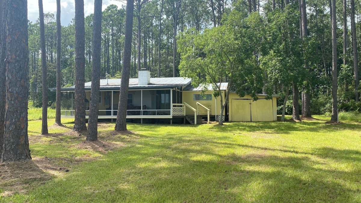 Carrabelle Cottage | Remodeled historic cottage with a peek of the Gulf of Mexico.