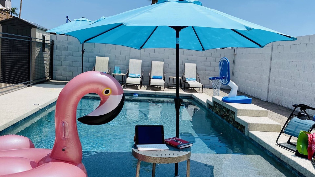 Phoenix House | Resort Style Backyard- Heated Pool, Putting Green, Outdoor TV and Pool Table.