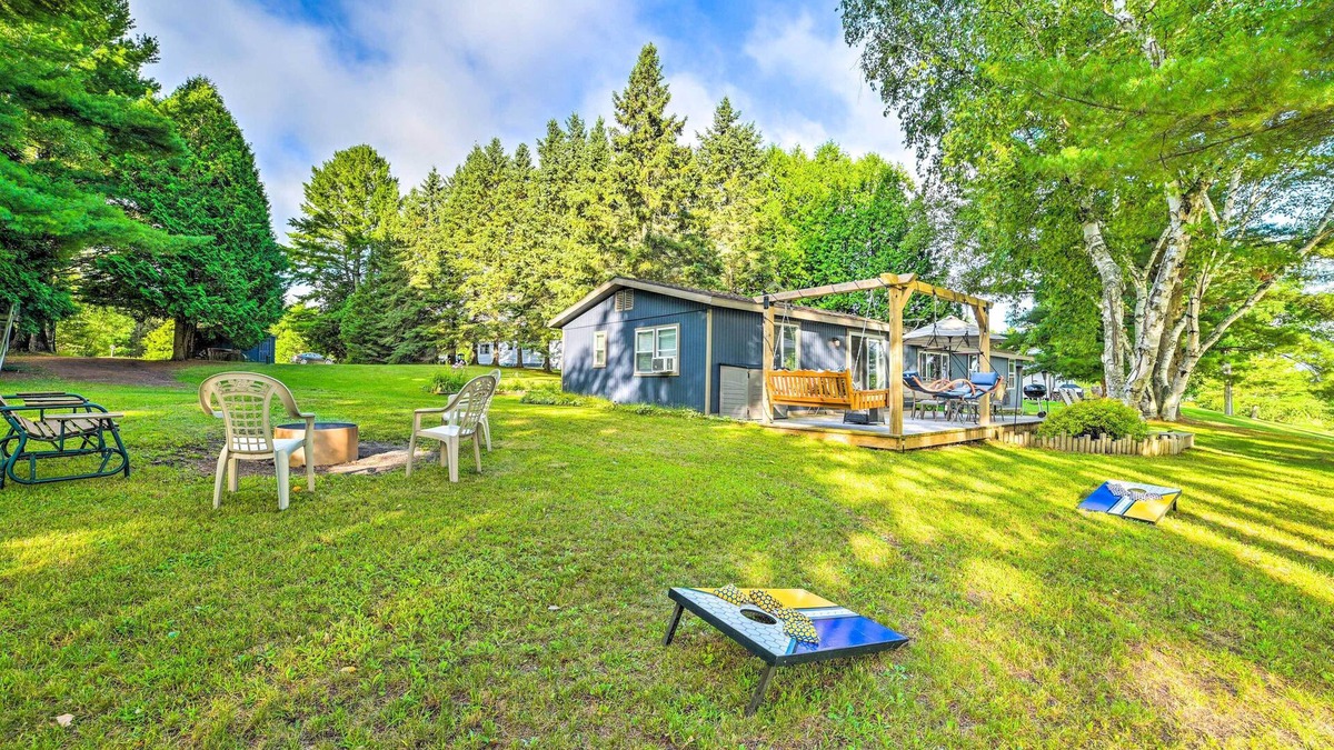 Cheboygan Cottage | Riverfront Home w/Dock ~ 6 Mi to Cheboygan!