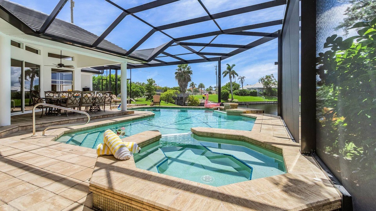 Pelican House | Riverfront Luxury with Heated Pool, Spa & Private Dock – Sunny Shores Escape