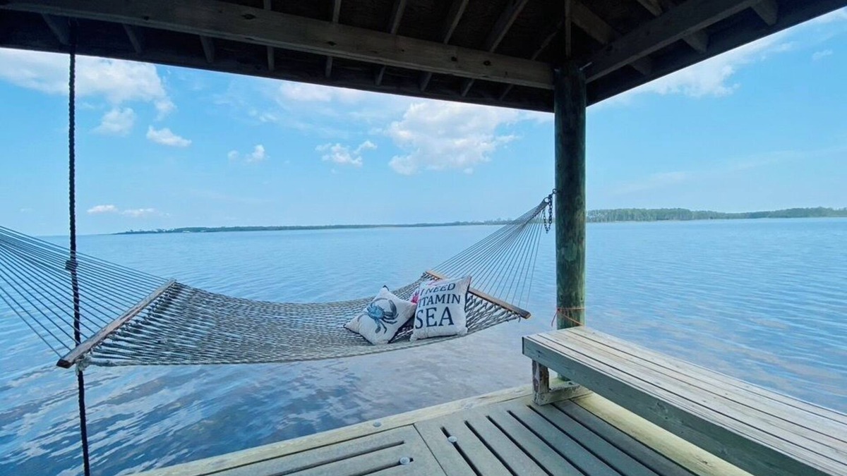 Hobucken House | Riverfront property with dock and ramp. Dolphins, fish, boat, swim & more