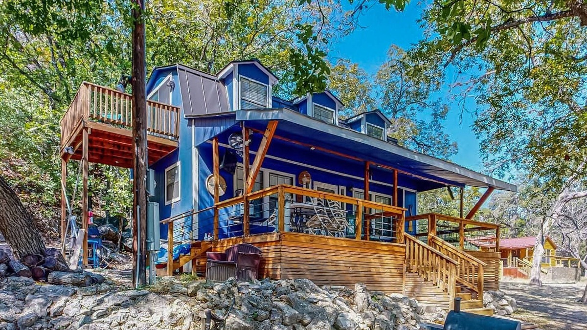 Bandera Cottage | Riverside Retreat with outside dining area, deck and internet