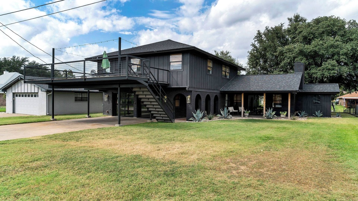 Granbury House | Rockstar waterfront lake house! Mid century modern with large 2 story party deck