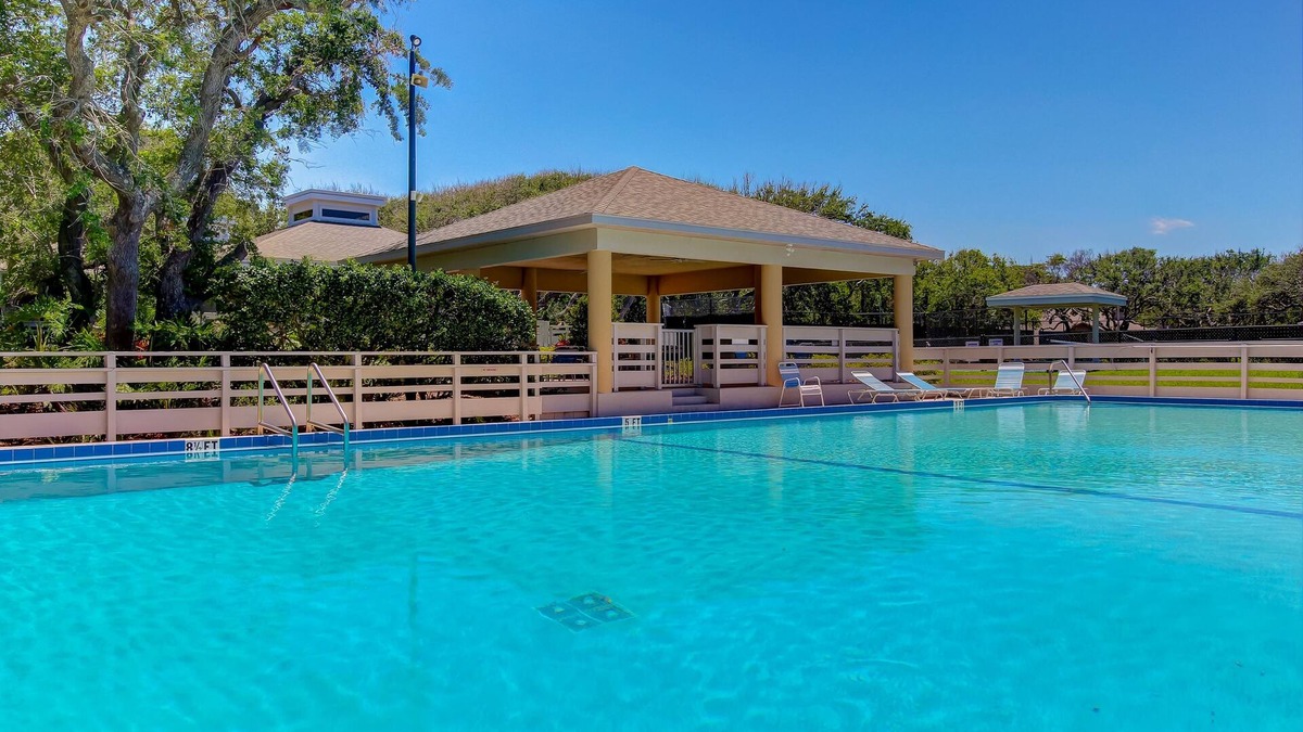 New Smyrna Beach Villa | Row-end condo with pool, clubhouse, tennis, & walk to beach