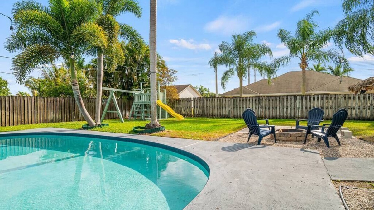 Royal Palm Beach House | Royal Retreat w/ Pool, Grill & Playground!