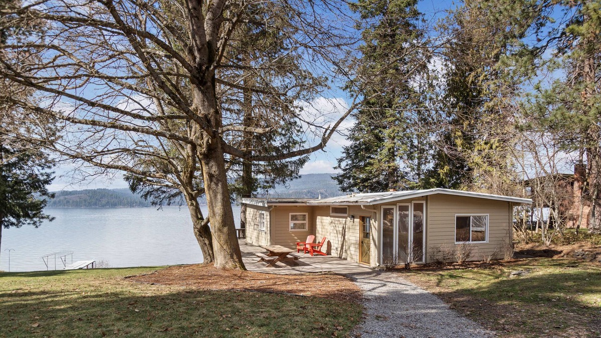 Harrison House | Rustic lakefront retreat with private beach, dock & large deck - dog-friendly