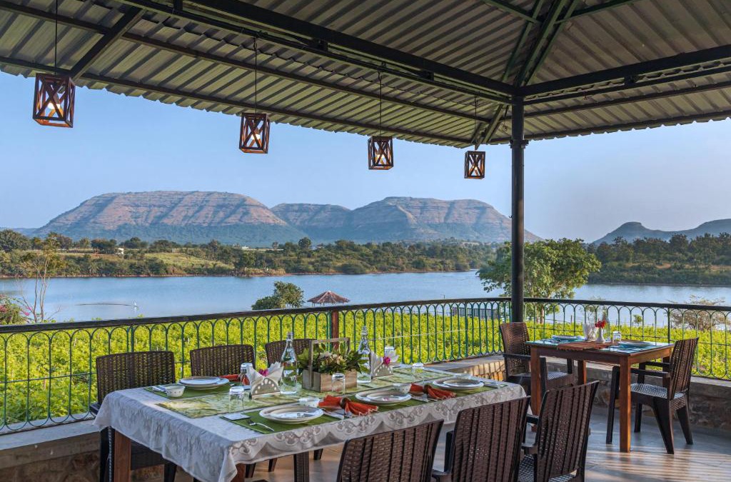 Mahiravani Villa | SaffronStays Lake House Bouganvillea, Nashik - rustic pool villa with great lake views and patio dining