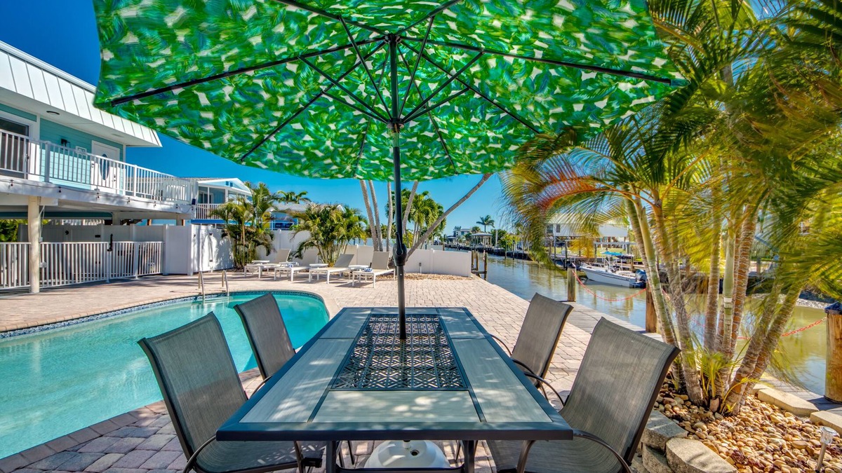 South Island House | Sand Dollar #4 - Upstairs Apt with shared Pool on Canal by the Beach!