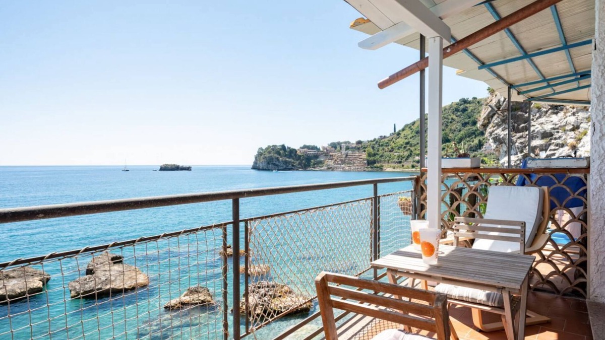 Spisone Apartment | Sea view apartment of about 90 sqm, able to accommodate up to 4 people, located on the ground floor of a building.The property is located in Taormina, in a unique panoramic position, suspended above a rock and with the beach right in front of the apartme