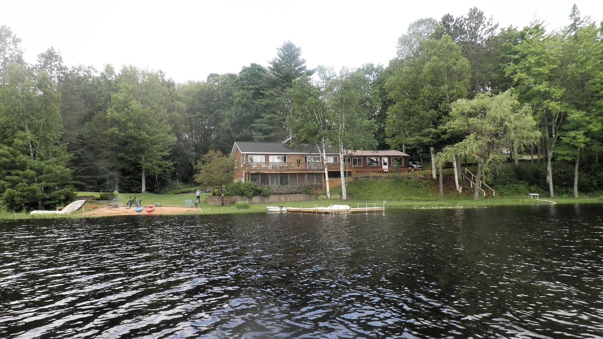 Rapid River Cabin | SECLUDED LODGE WITH ONE OF THE LARGEST PRIVATE STOCKED LAKES IN MICHIGAN.