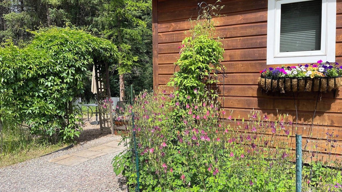 Whitefish Cottage | Secret Garden, king bed Cottage