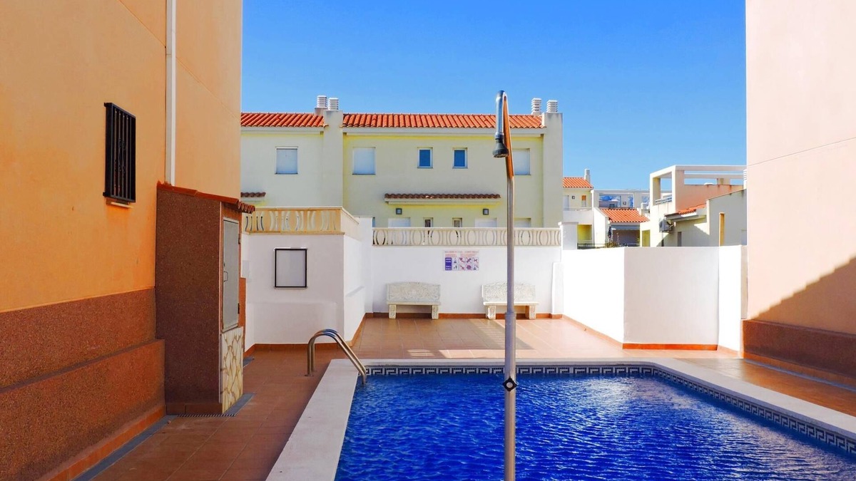 Miami Platja Cottage | Semi-detached house with community pool in Miami Playa 400 meters from the sea