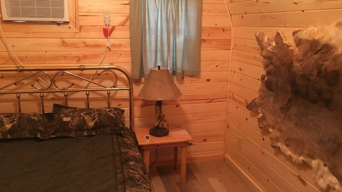 Hugo House | Small one room cabins with no bathrooms hot tub and covered picnic tables.