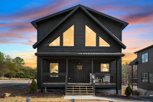 Pigeon Forge House | SmokiesBoutiqueCabins would love to host you at our NEW cabin! 3 King Suites, Indoor Pool, Game Room, Lounge with 75" TV! Close to Dollywood and the Parkway!
