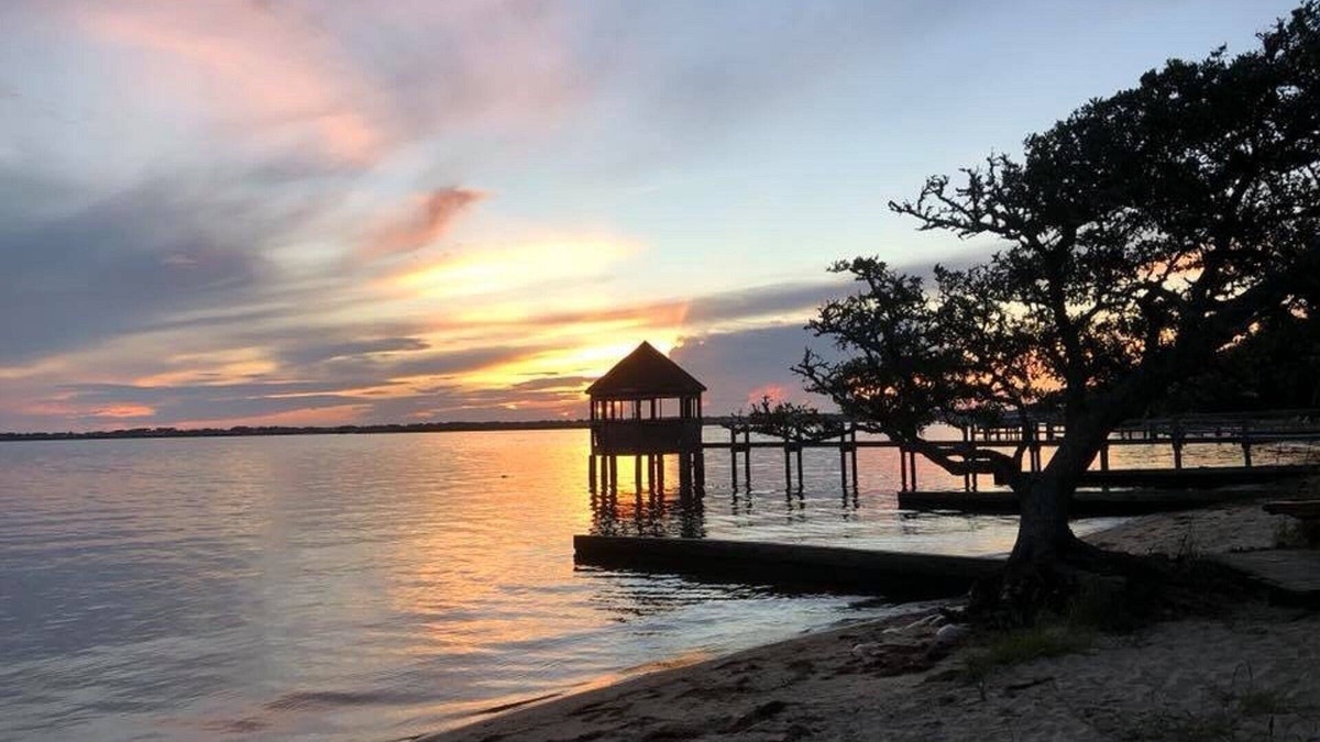 Colington Harbour Cottage | Soundfront Beach House with Kayaks, Sailboat & lots of Beach Toys!