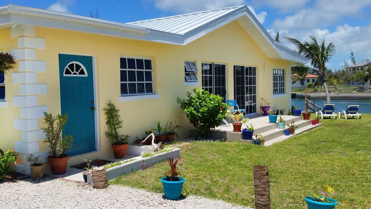 Williams Town House | Spacious 4-Bedroom Villa, on a Lovely Waterway, with Beach and Ocean Views