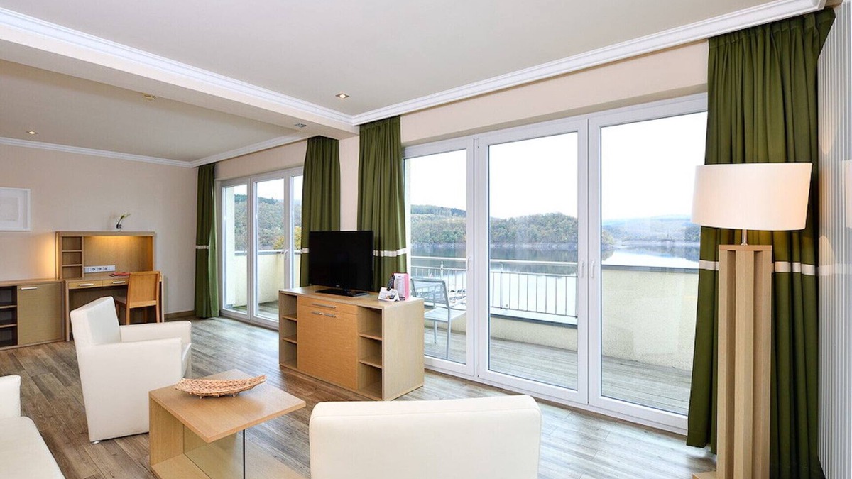 Heimbach Apartment | Spacious double suite with balcony and lake view