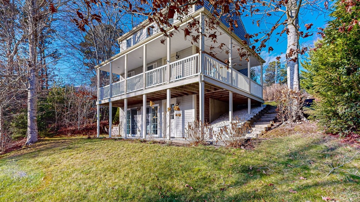 Mashpee House | Spacious home close to Peters Pond Beach with porch, AC, W/D, & water view