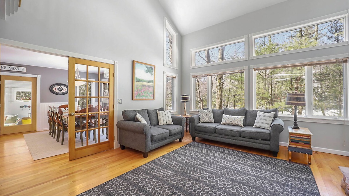 Maple City House | Spacious home with studio, lake access, sunroom, fireplace, W/D, & central AC