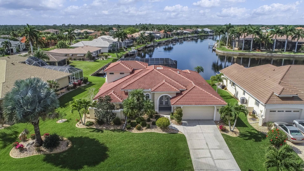 Burnt Store Isles House | Spacious, waterfront home with dock, heated pool, and lanai
