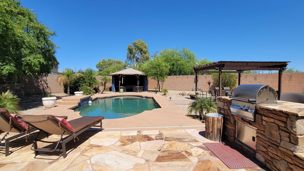 Surprise Farms House | Spectacular oasis with private pool, large yard, & game room
