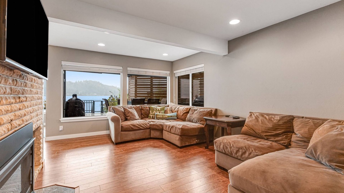 Olympia House | Sprawling lakefront property with kayaks, large deck, game table, & fireplace