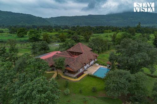 Sangavi Villa | StayVista at Orchard by the River with Bonfire, BBQ