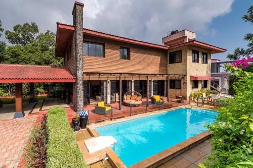 Kune N.m. Villa | StayVista's Woodstone Villa - Mountain Retreat with Heated Pool & Activities