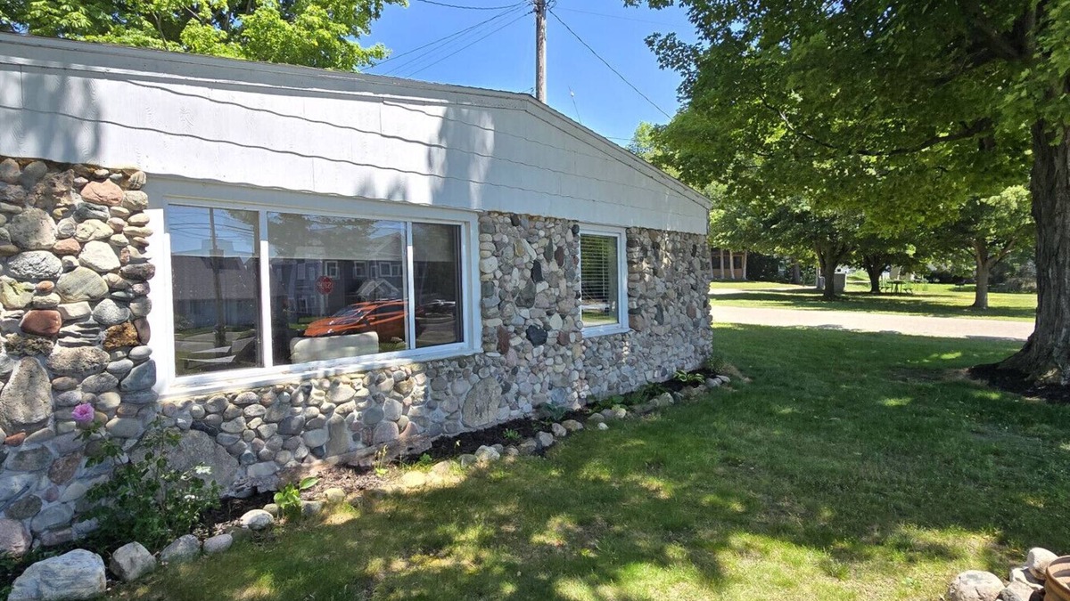 Onekama House | Stone Cottage on Portage Lake with Private Dock