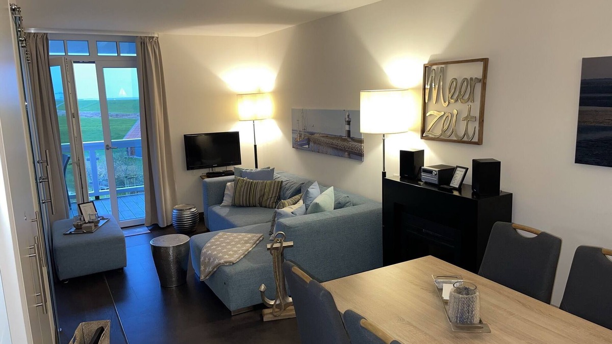 Wremen Apartment | Strandnahe Ferienwohnung mit Sauna, Strandkorb und Balkon mit Land- & Meerblick
