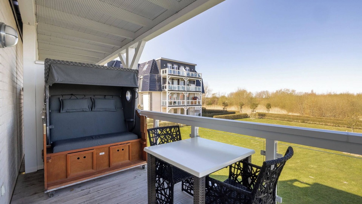 Wremen Apartment | Strandnahe Ferienwohnung mit Sauna und Tollem, Großem Balkon mit Xxl-strandkorb