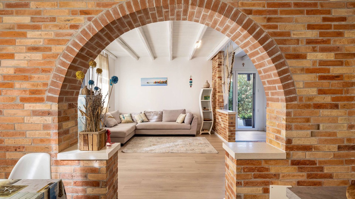 Castello di Brussa Apartment | Studio Apartment 'Appartamento Brussa Beach' with Private Terrace, Wi-Fi and Air Conditioning
