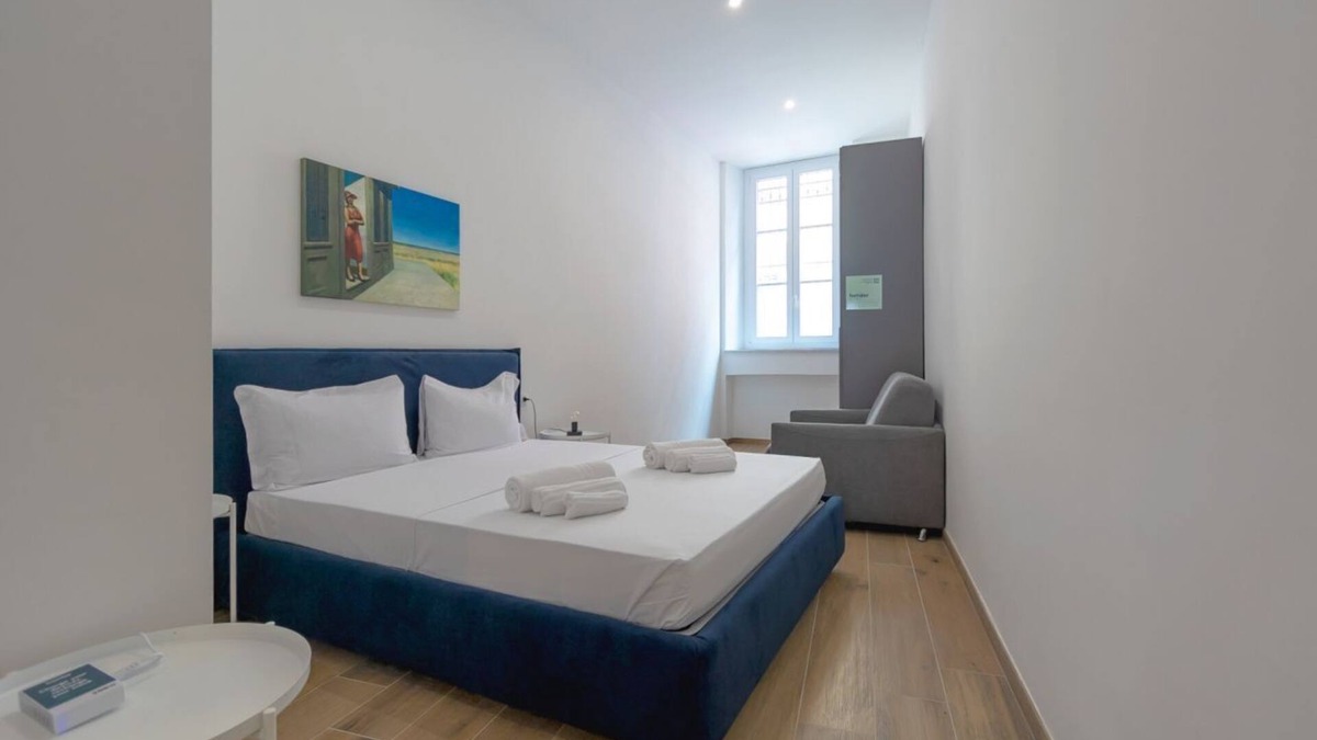 San Donato - Campidoglio Apartment | Studio apartment with double bed, armchair bed and equipped kitchenette.