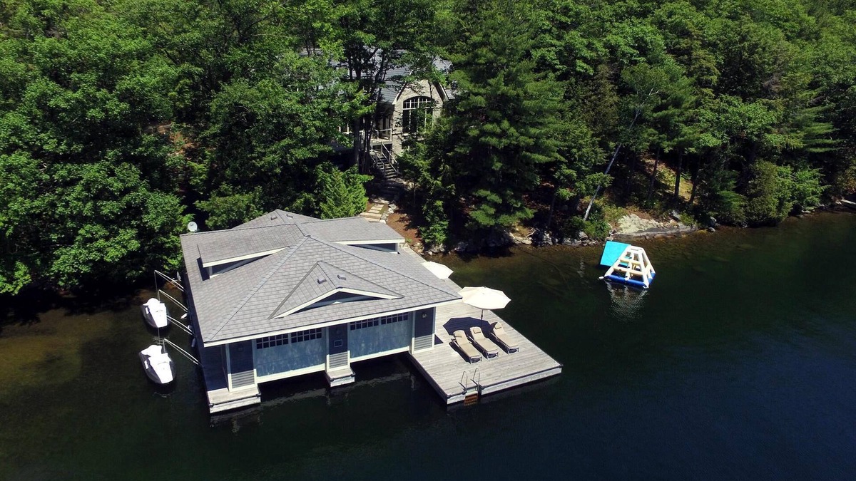 Muskoka Lakes Villa | Stunning Cottage on Lake Joe! 6 bdrm,6 bath,2 slip boathouse! Water Toys Galore!