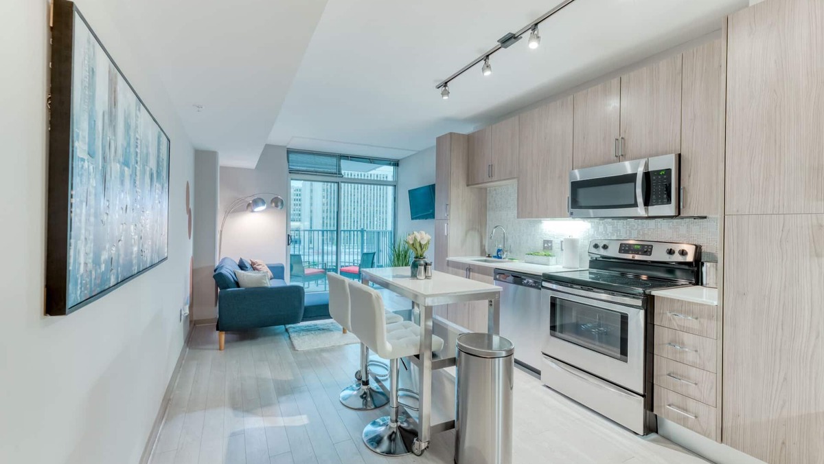 Aurora Highlands Condo | Stunning Highrise w/private Rooftop Ideal Location
