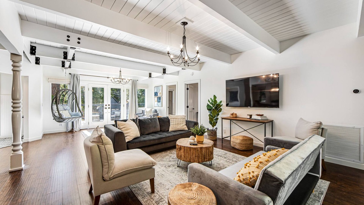 Cedar Glen House | Stunning lakehouse lodge with a deck, fireplace, lush patio & lake access