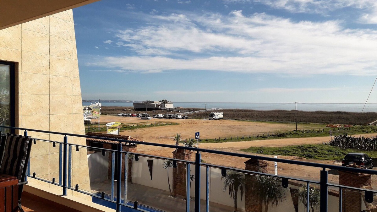 Meia Praia Apartment | Stunning Modern 2 Bedroom Apartment with Seaviews and Communal Roof Terrace Pool