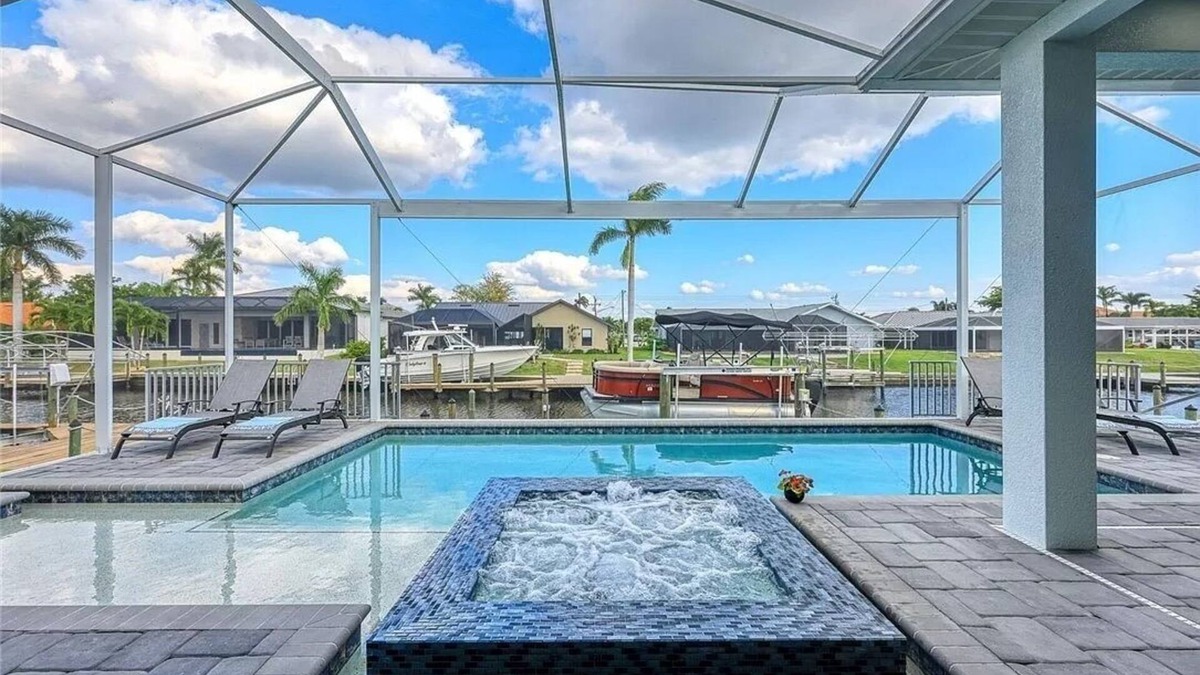 Pelican Villa | Stunning New Waterfront Luxury Villa with oversized Heated pool and Hot tub!