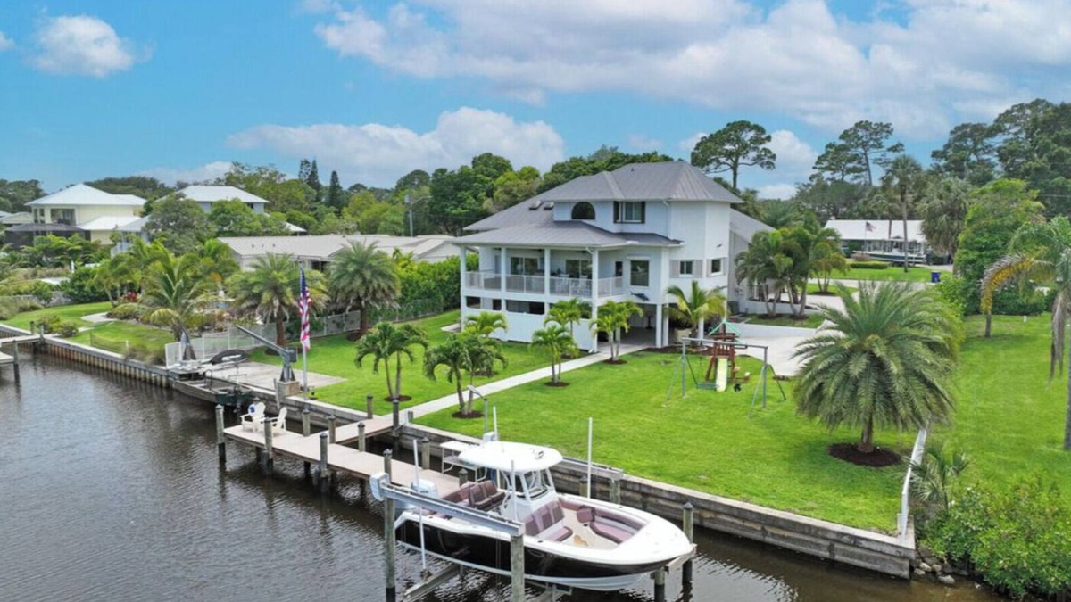 Palm City House | Stunning Water Front River House with Gourmet Kitchen & Large Boat Dock!
