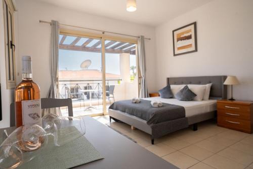 Peyia Town Apartment | Stylish Studio with Pool and Balcony Hillside and Sea Views For Business or Leisure Travellers