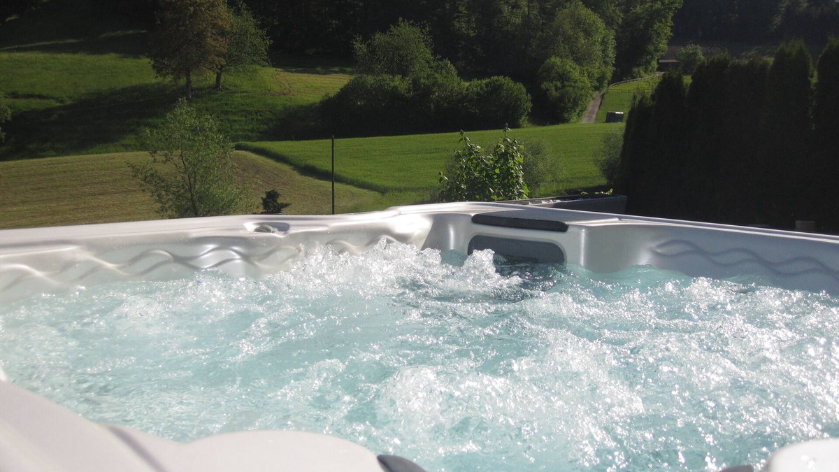 Kulm Apartment | Sun terrace with Jacuzzi & shower experience with views of woods & meadows