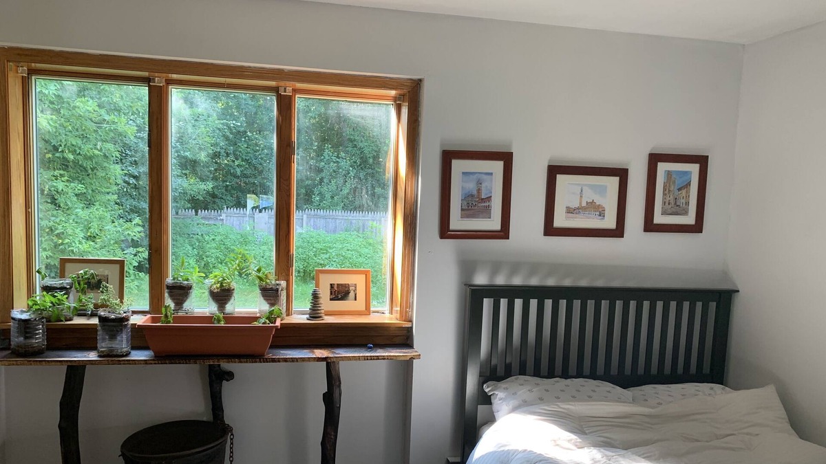 Waddington House | Sunny bedroom with full bed and private bathroom.