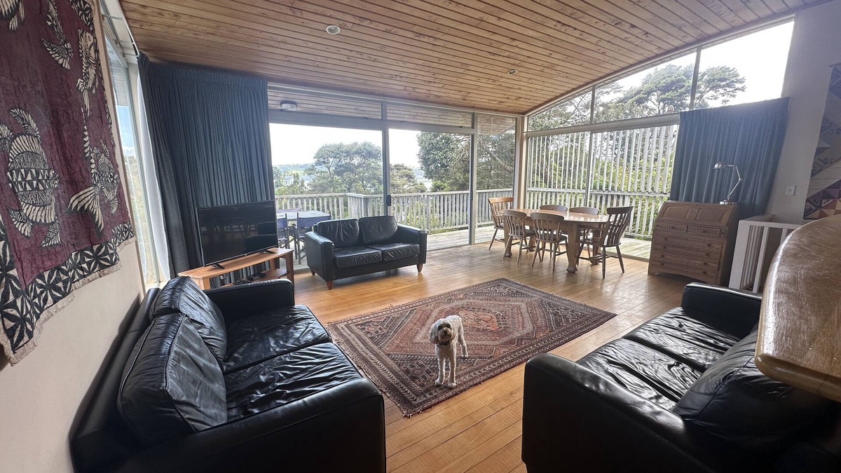 Raglan House | Sunny with decks and bush/harbour views. Three bedrooms. Pet friendly.