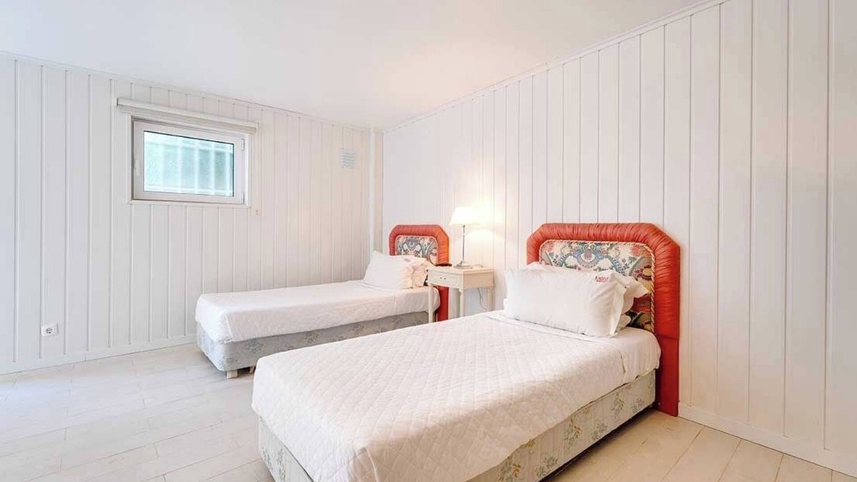 Santa Eulalia Villa | Sunrise Beach Villa Room Steps from the Shore