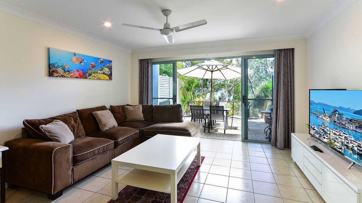 Hamilton Island Apartment | Sunset Waters 01 - Marina Side 2 Bedroom with buggy.